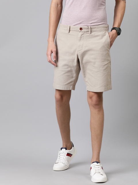

Tommy Hilfiger Men Beige Self Design Regular Fit Regular Shorts