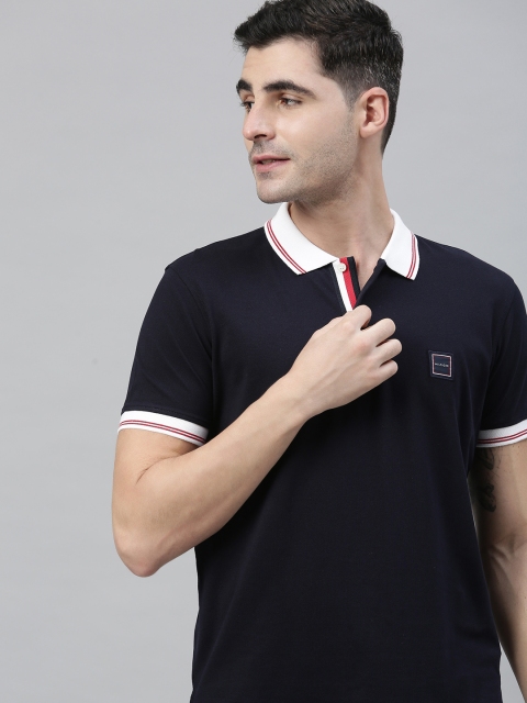 

Tommy Hilfiger Men Navy Blue Solid Polo Collar T-shirt