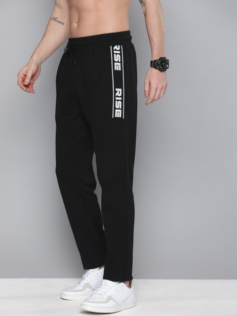 

HERE&NOW Men Black Solid Regular Fit Track Pants with Printed Detail