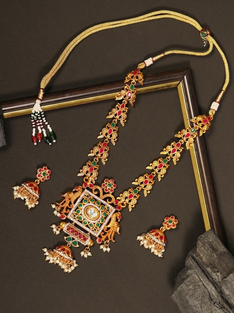 

Priyaasi Magenta Gold-Plated Stone-Studded Peacock Pattern Handcrafted Jewellery Set