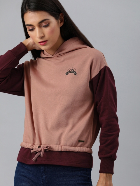 

Roadster Women Peach Solid Hooded Sweatshirt With Mock hem detail