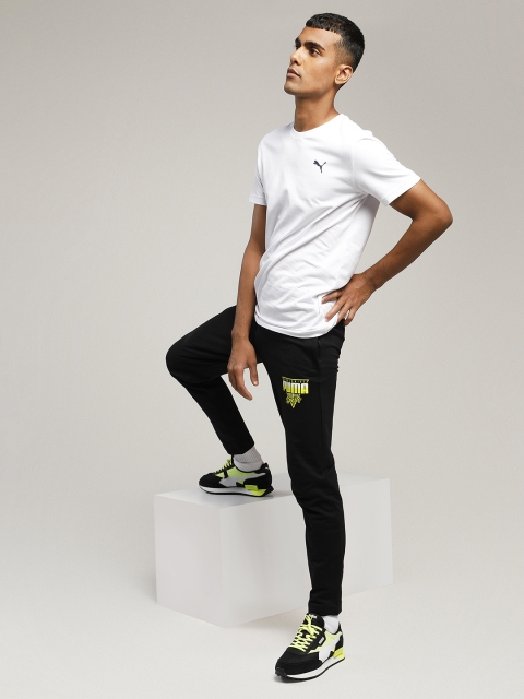 

Puma Men Black & Yellow Printed Worldwide Graphic Track Pants