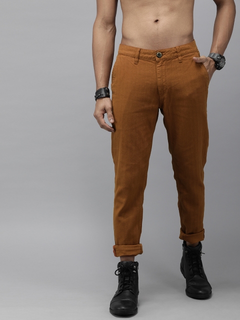 

Roadster Men Rust Orange Regular Fit Self Striped Regular Trousers