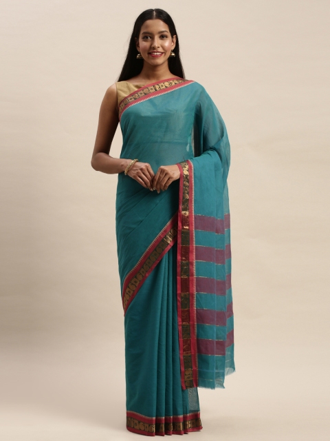 

Mitera Teal Blue Silk Cotton Solid Handloom Baluchari Saree