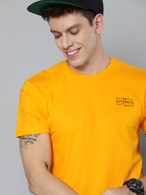 

HERENOW Men Mustard Yellow Solid Round Neck Pure Cotton T-shirt with Printed Detailing