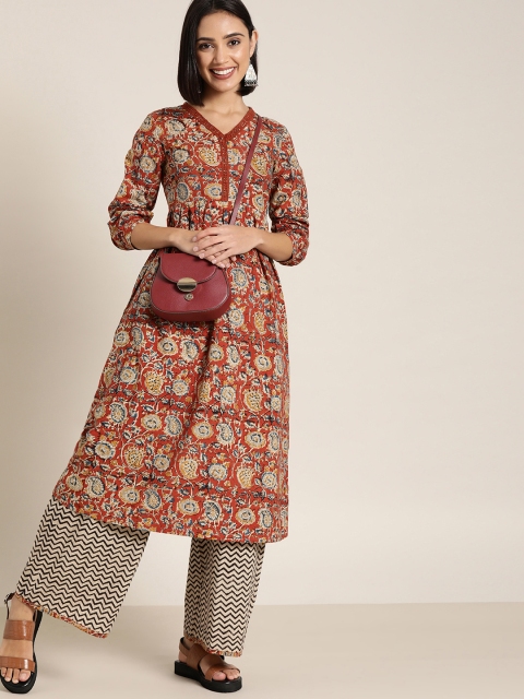 

Taavi Women Beige & Orange Printed Kurta with Palazzos