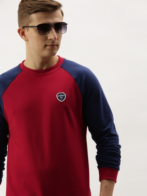 

PETER ENGLAND UNIVERSITY Men Red & Navy Blue Solid Sweatshirt