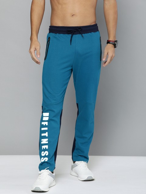 

HERE&NOW Men Teal Blue Solid Straight Fit Track Pants With Printed Detailing