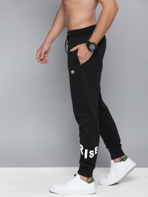 

HERE&NOW Men Black Solid Joggers with Printed Details