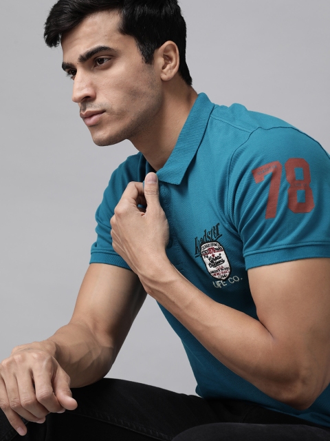 

Roadster Men Teal Blue Solid Polo Collar With Applique Detail