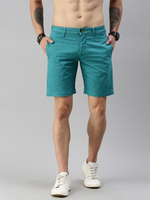 

Roadster Men Teal Green Self Design Regular Fit Regular Shorts