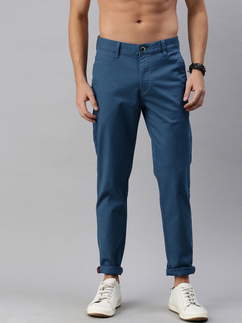 

Roadster Men Teal Self Design Regular Fit Trousers