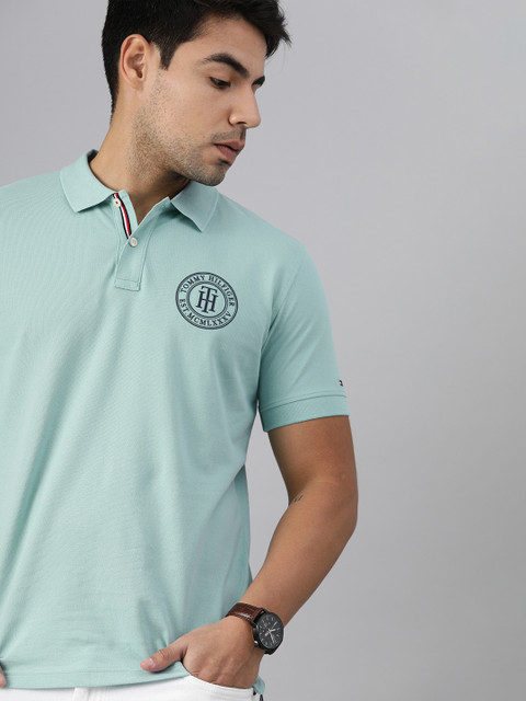 

Tommy Hilfiger Men Blue Solid Polo Collar Cotton T-shirt with Brand Logo Print Detail