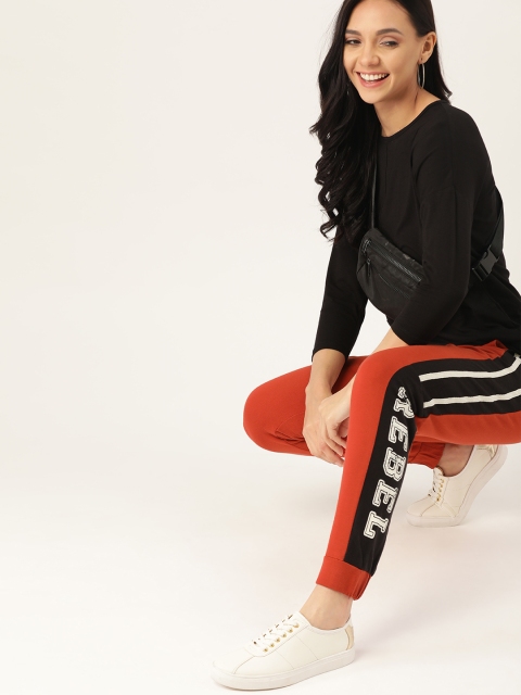 

DressBerry Women Rust Red Solid Joggers with Printed Side Panel Detail