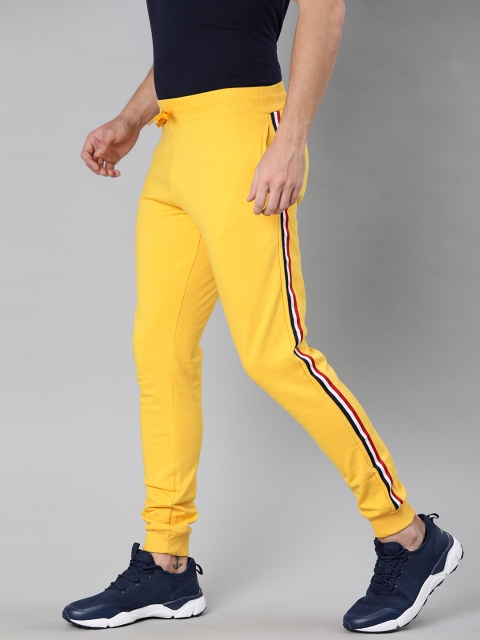 

Urbano Fashion Men Yellow Solid Slim Fit Joggers With Side Stripes
