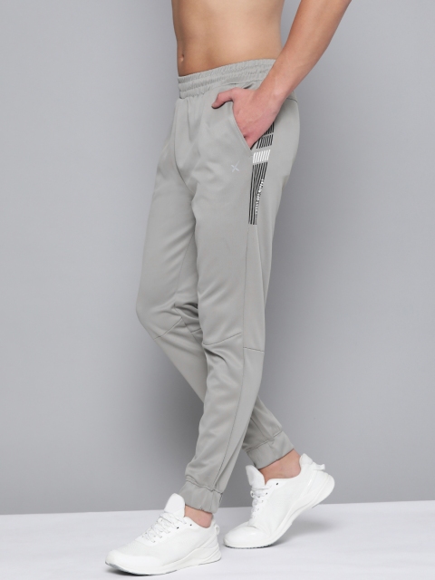 

HRX By Hrithik Roshan Men Wet Weather Abstract Slim Fit Rapid-Dry Antimicrobial Training Joggers, Grey