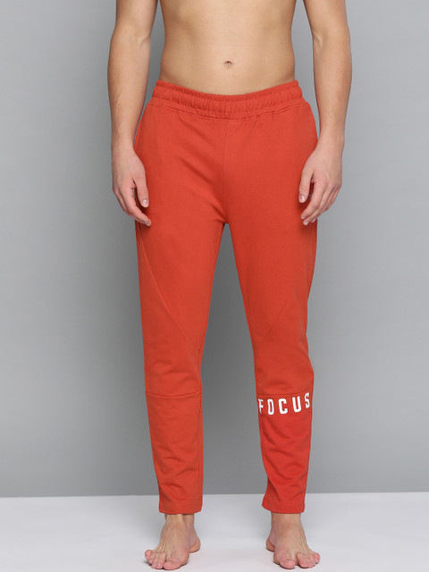 

HRX By Hrithik Roshan Men Tandoori Spice Typographic Slim Fit Organic Cotton Antimicrobial Yoga Track Pants, Rust