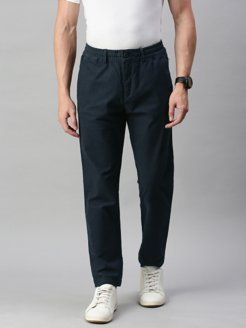 

Tommy Hilfiger Men Navy Blue Regular Fit Checked Regular Trousers