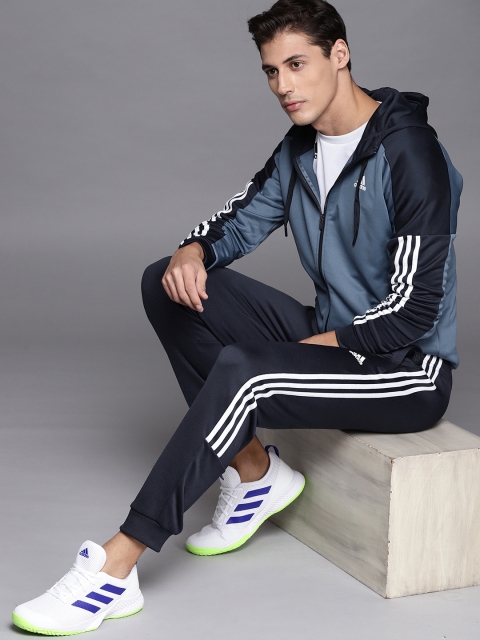 

ADIDAS Men Blue MTS Game Time Solid Slim Fit Tracksuit