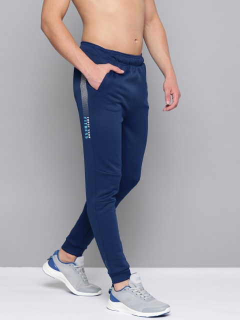 

HRX By Hrithik Roshan Men Estate Blue Typographic Slim Fit Rapid-Dry Antimicrobial Training Joggers, Navy blue