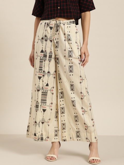 

Sangria Women Beige & Black Printed Flared Palazzos