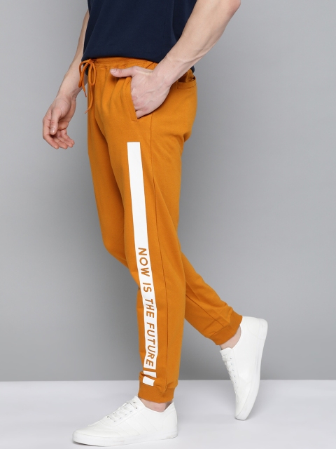 

Mast & Harbour Men Mustard Yellow Pure Cotton Solid Joggers With Typographic Detail