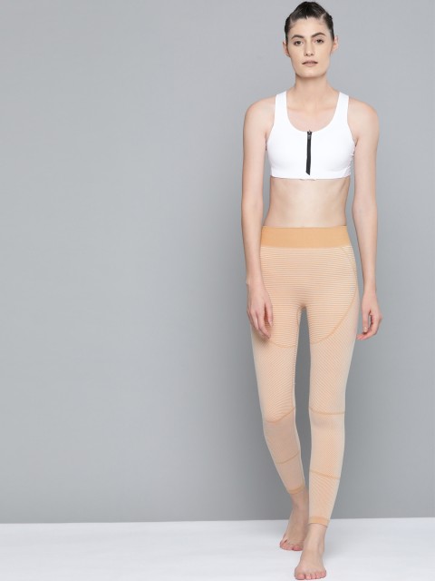 

HRX By Hrithik Roshan Women Camel Solid Skinny Fit Seamless Rapid-Dry Antimicrobial Yoga Tights, Mustard