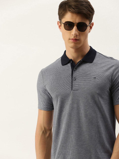 

Calvin Klein Jeans Men Navy Blue & White Self Design Slim Fit Polo Collar T-shirt