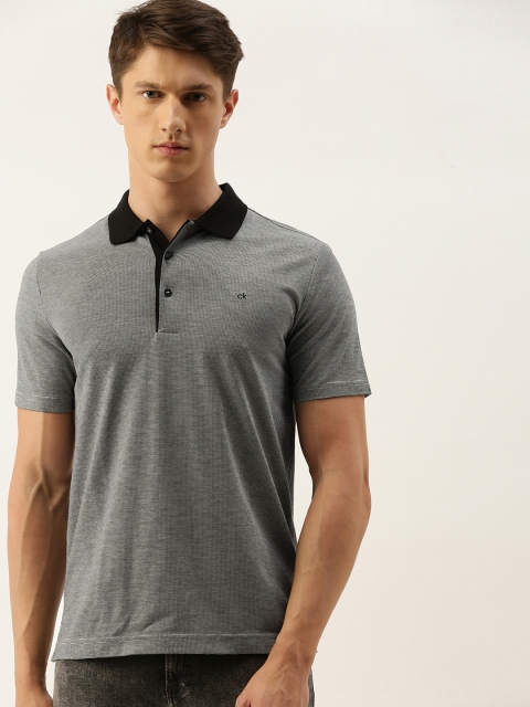 

Calvin Klein Jeans Men Black & White Self Design Slim Fit Polo Collar T-shirt