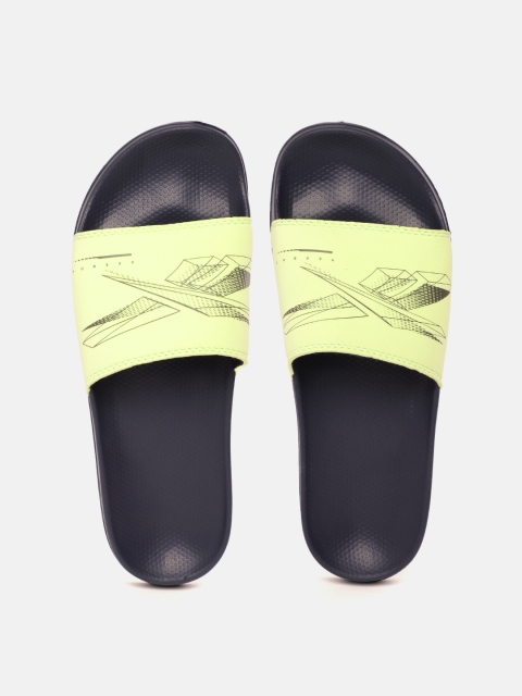 

Reebok Men Yellow & Navy Blue Vector Brand Logo Print Sliders