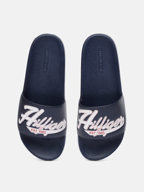 

Tommy Hilfiger Men Navy Blue & White TMERIE Self Design Sliders