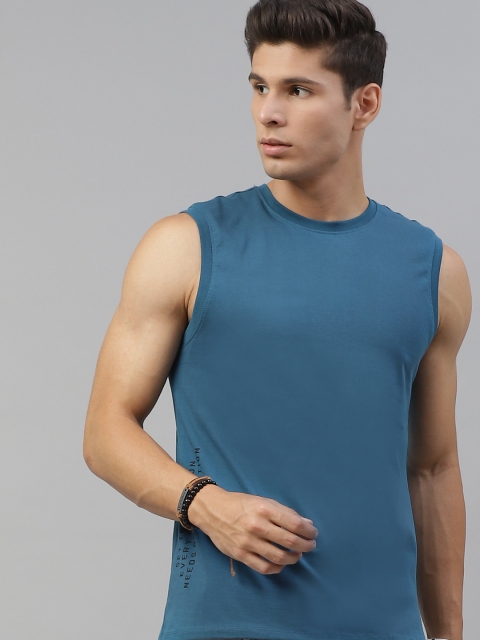 

The Roadster Lifestyle Co Men Teal Blue Solid Pure Cotton T-shirt