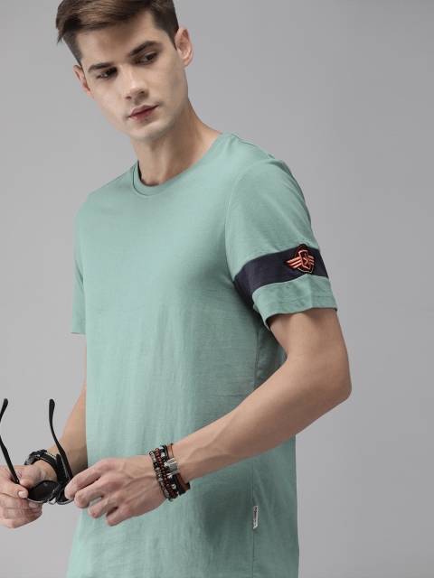 

The Roadster Lifestyle Co Men Green Solid Round Neck Pure Cotton T-shirt