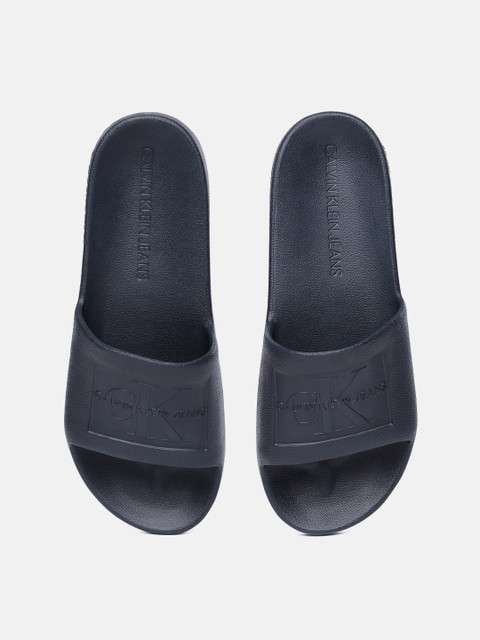 

Calvin Klein Men Navy Blue Self Design Sliders
