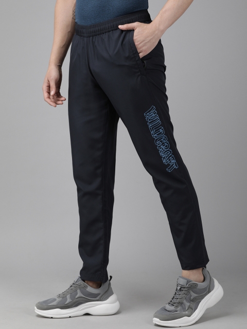 

Wildcraft Men Navy Blue Solid Straight Fit Track Pants with Printed Detail