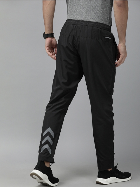 

Wildcraft Men Black Solid Straight Fit Track Pants with Printed Detail
