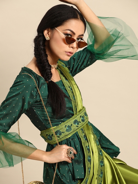 

Tikhi Imli Green Solid Saree With Semi-Stitched Peplum Blouse