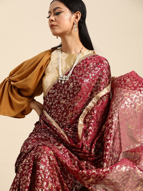 

Tikhi Imli Burgundy & Golden Foil Printed Satin Celebrity Saree