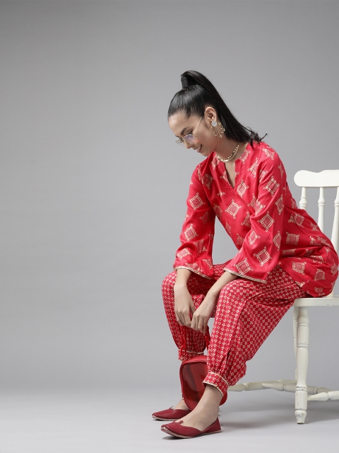 

Indo Era Women Pink & Golden Printed Kurta with Salwar