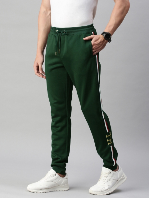 

Tommy Hilfiger Men Green Solid Joggers With Side Stripes