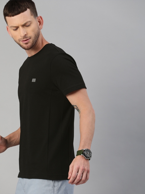 

Tommy Hilfiger Men Black Solid TH Cool Round Neck T-shirt
