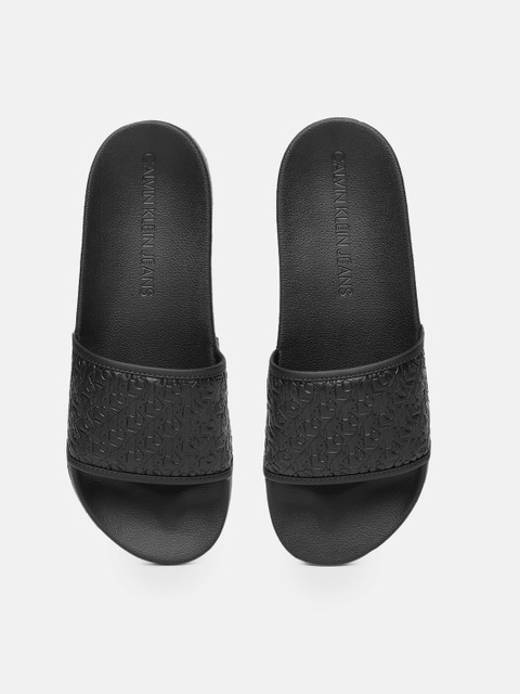 

Calvin Klein Men Black Self Design Sliders