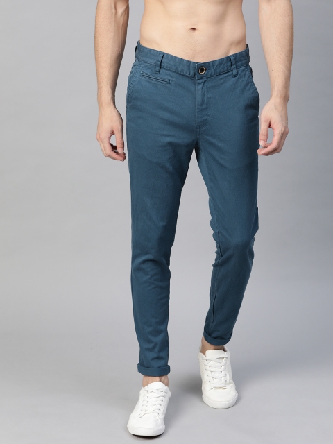 

Roadster Men Teal Blue Solid Tapered Fit Regular Trousers