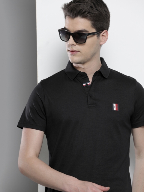 

Tommy Hilfiger Men Black Solid Pure Cotton Polo Collar T-shirt