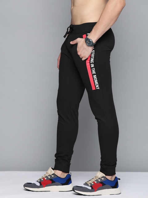 

Kook N Keech Men Black Solid Joggers With Printed Detail