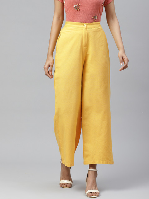 

Tulsattva Women Yellow Smart Flared Self Design Cotton Regular Trousers