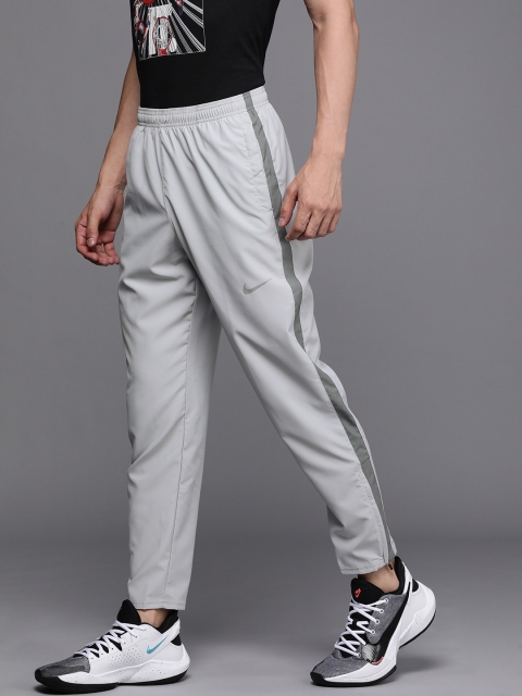 

Nike Men Black Straight Fit Solid Dri-FIT NK DF RUN STRIPE WVN Running Track Pants, Grey