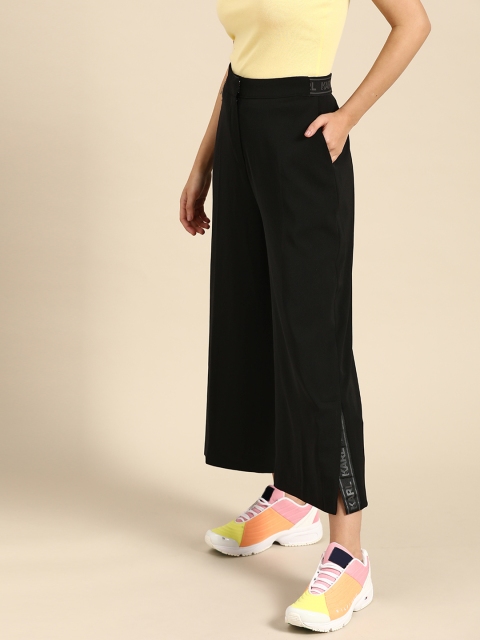 

COVER STORY Women Black Flared Solid Parallel Trousers