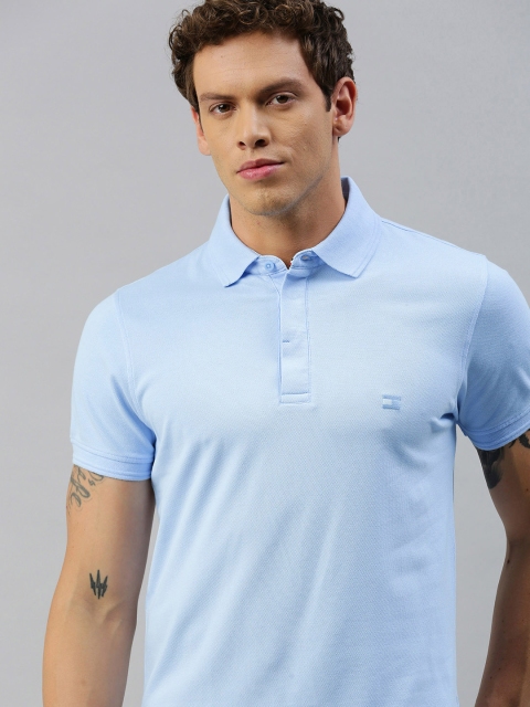 

Tommy Hilfiger Men Blue Solid Polo Collar T-shirt