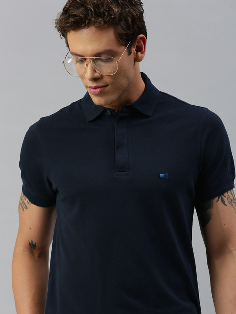 

Tommy Hilfiger Men Navy Blue Solid Polo Collar T-shirt